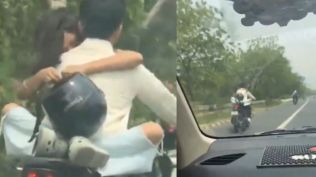 The five-second clip, which went viral on Sunday, shows neither of them wearing a helmet, though the woman casually holds one in her hand. The bike bears a Delhi number plate.