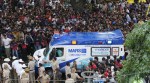 An ambulance arrives at the M. Chinnaswamy Stadium as fans gather to celebrate Royal Challengers Bengaluru's IPL title win (AP Photo)