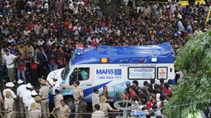 An ambulance arrives at the M. Chinnaswamy Stadium as fans gather to celebrate Royal Challengers Bengaluru's IPL title win (AP Photo)