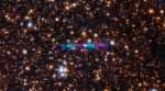 3I/ATLAS streaks across a dense star field in this image captured by the Gemini North telescope's Gemini Multi-Object Spectrograph (GMOS-N). The image is composed of exposures taken through three filters, shown here as red, green and blue. (Image Source: International Gemini Observatory)
