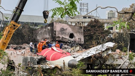 NDRF personnel remove the debris of the crashed Air India aircraft