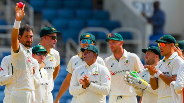 Australia's Mitchell Starc shows the ball after dismissing West Indies' Mikyle Louis to claim his 400th wicket in Test cricket on day three of the third Test match at Sabina Park in Kingston, Jamaica. (AP Photo)