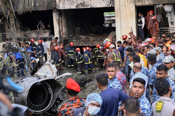 The plane had hit the side of a building, damaging its walls and iron grills. (AP Photo)