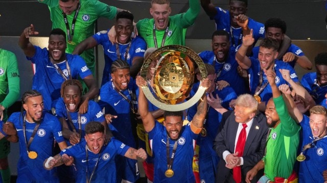 Chelsea players celebrate with the FIFA Club World Cup trophy. (AP)