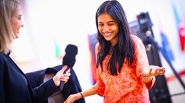 An elated Divya Deshmukh reacts after defeating grandmaster Harika Dronavalli in the quarter-finals of the FIDE World Cup. (FIDE/Anna Shtourman)