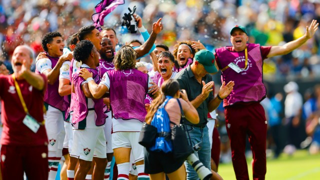 Fluminense manager Renato Gaucho, wearing cap, and his players celebrate after Hercules scored their second goal during the Club World Cup soccer match against Inter Milan. (AP Photo)