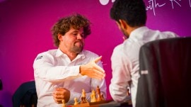 Magnus Carlsen takes on Gukesh in a game at the SuperUnited Rapid and Blitz chess tournament in Zagreb. (PHOTO: Grand Chess Tour via Lennart Ootes)