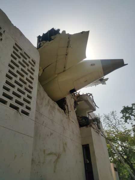 The wings of the aircraft shaved off the tops of the trees right next to the building, hit a chimney stack on the military hospital premises located next door, and then hit the hostel building (mess).