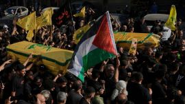 Mourners carry the coffin of Abu Ali Khalil, the bodyguard and head of security for late Hezbollah leader Sayyed Hassan Nasrallah, who was killed in an Israeli airstrike in Iran on June 21. (AP Photo)