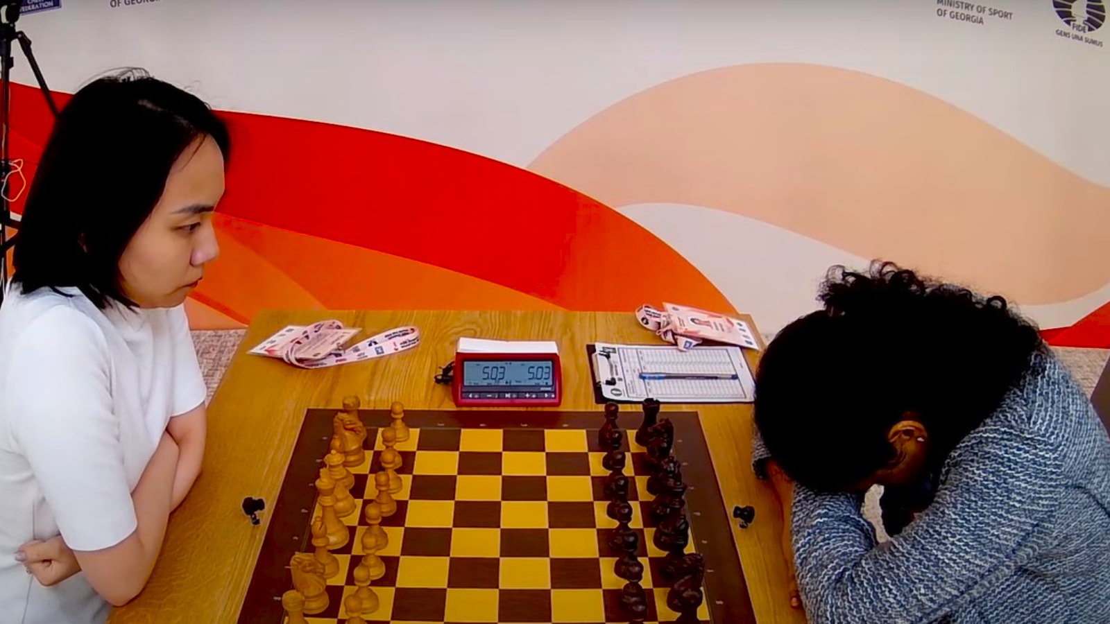 Koneru Humpy awaits for the start of a game against China's Lei Tingjie in the tiebreaks of the FIDE Women's World Cup semi-finals at Batumi. (PHOTO: Screengrab via FIDE YouTube)