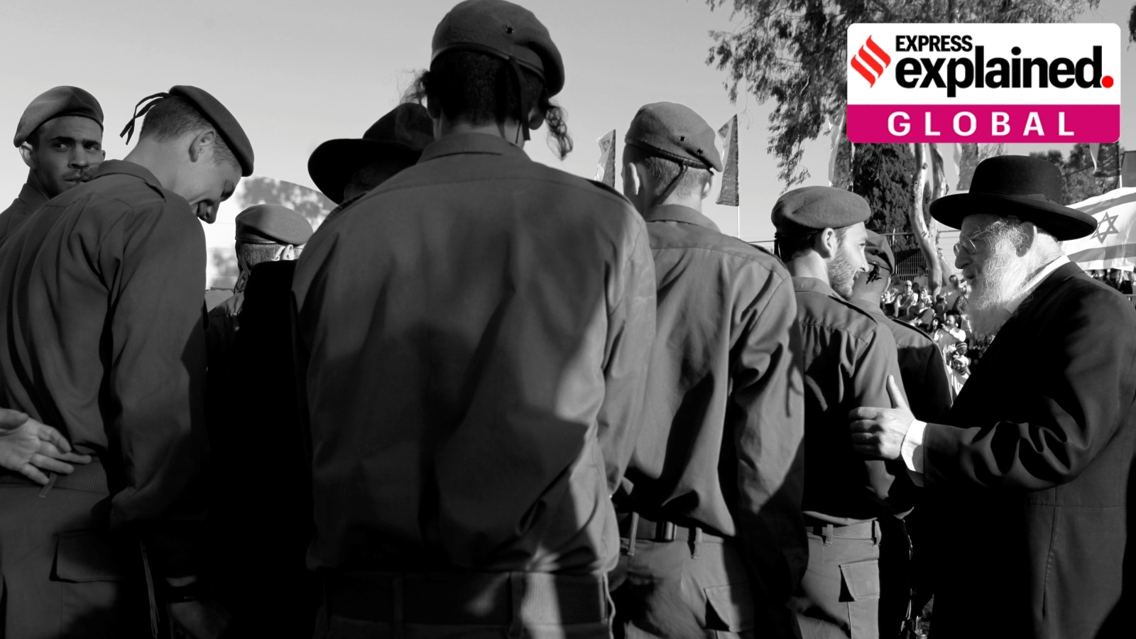 A rabbi of the Netzah Yehuda Haredi battalion encourages soldiers during a swearing-in ceremony, in Jerusalem.