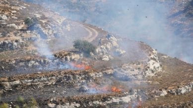 Israeli settlers clash with demonstrators during the protest of American-Palestinian landlords in the West Bank villages of Sinjil and al-Mazra'a ash-Sharqiya, in Sinjil, north of Ramallah Friday, July 4, 2025. (AP Photo/Nasser Nasser)