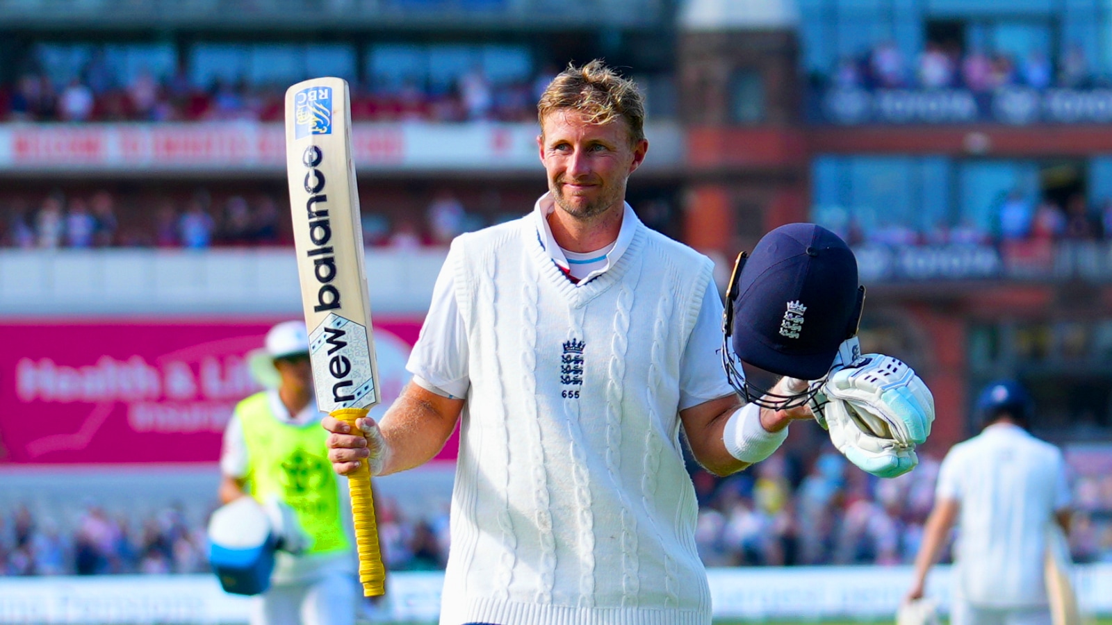 England's Joe Root acknowledges fans as he walks off the field after losing his wicket on the third day of the fourth cricket Test at Old Trafford, Manchester. (AP Photo)