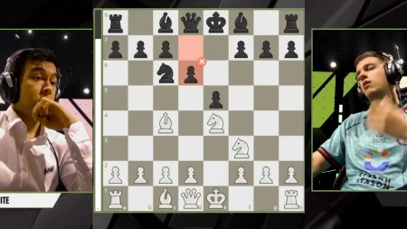 Nodirbek Abdusattorov (left) and Jan-Krzysztof Duda react after the latter's mouse-slip in an Armageddon game at the Esports World Cup. (Screengrab via EWC)