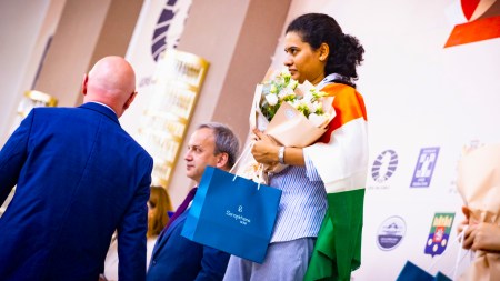 Koneru Humpy on the podium during the awards ceremony for the FIDE Women’s World Cup in Batumi. (PHOTO: FIDE via Anna Shtourman)