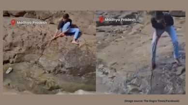In the viral video, the man can be seen struggling to retrieve one of his slippers floating in water (Image source: @TheDograTimes/Facebook)