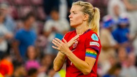 Norway's Ada Hegerberg, sporting the rainbow armband, reacts to fans on the pitch after losing the Women's Euro 2025 quarterfinals soccer match between Norway and Italy at Stade de Geneve in Geneva. (AP Photo)