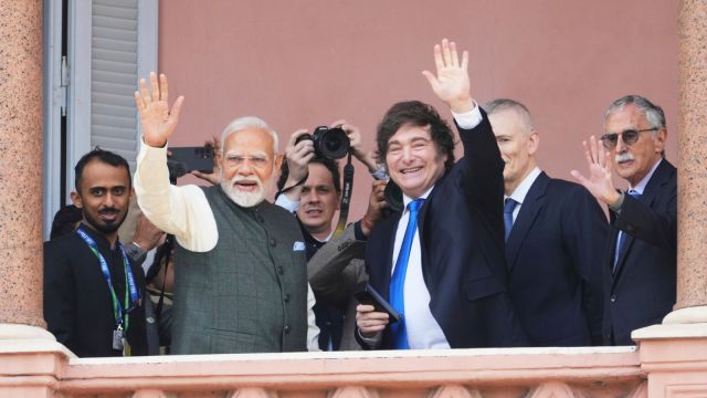Argentine President Javier Milei, right center, and Indian Prime Minister Narendra Modi wave from a Government House balcony, in Buenos Aires, Argentina, Saturday, July 5, 2025. (AP Photo/Rodrigo Abd)