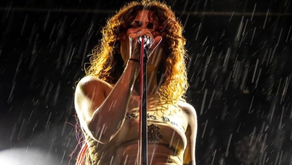 French singer Rebecca Baby strips in protest