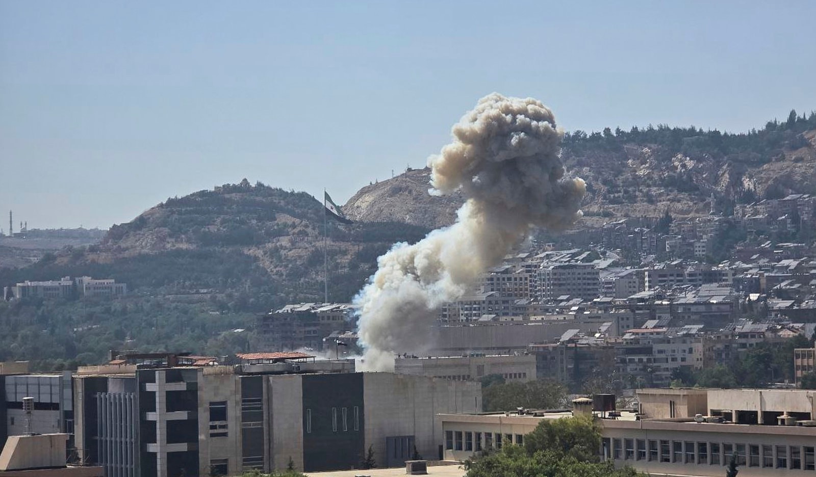 Smoke rises from an israeli airstyke that hit the syrian defense ministry in Damascus on Wednesday