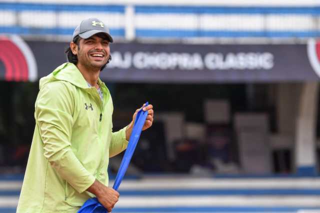 Neeraj Chopra laughs before a training session at the Kanteerava Stadium in Bengaluru.