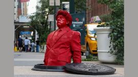 Trump red statue