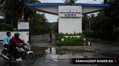 Motorists pass by the entry gate of Mahanand Diary where there was an ammonia gas leakage last night, at Goregaon east in Mumbai
