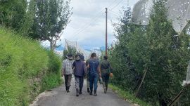 Woodcutters with electric machines on their way to Chaithla village.