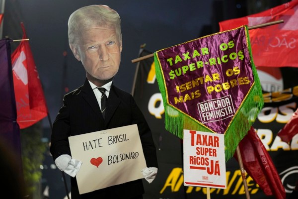 Protesters hold up an effigy of U.S. President Donald Trump in response to Trump's announcement of 50% tariffs on Brazilian goods, in Sao Paulo, Thursday, July 10, 2025.