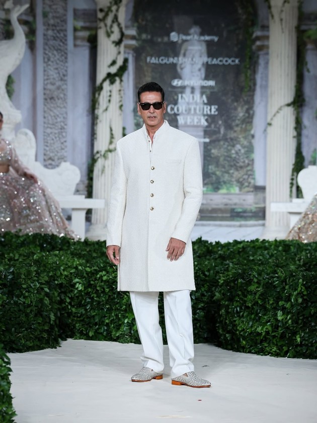 As the curtains fall on Hyundai India Couture Week 2025, the runway left behind a trail of shimmer, emotion, and showstopping glamour. From heritage-inspired storytelling to futuristic silhouettes, this year’s couture celebration was a spectacular meeting of craft and celebrity. With each designer unveiling a distinct vision—and some of Bollywood’s brightest lending their charisma to the catwalk—it was a week where tradition met innovation, and fashion became poetry in motion. Here’s a look back at all the stars who owned the spotlight, one stunning moment at a time.