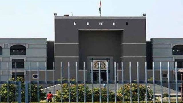 Gujarat High Court, Gujarat High Court contempt case, virtual court misconduct, virtual hearing toilet incident, man on toilet virtual court, community service contempt punishment,
