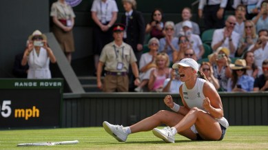 Iga Swiatek celebrates after beating Amanda Anisimova in the Wimbledon final. (AP Photo)