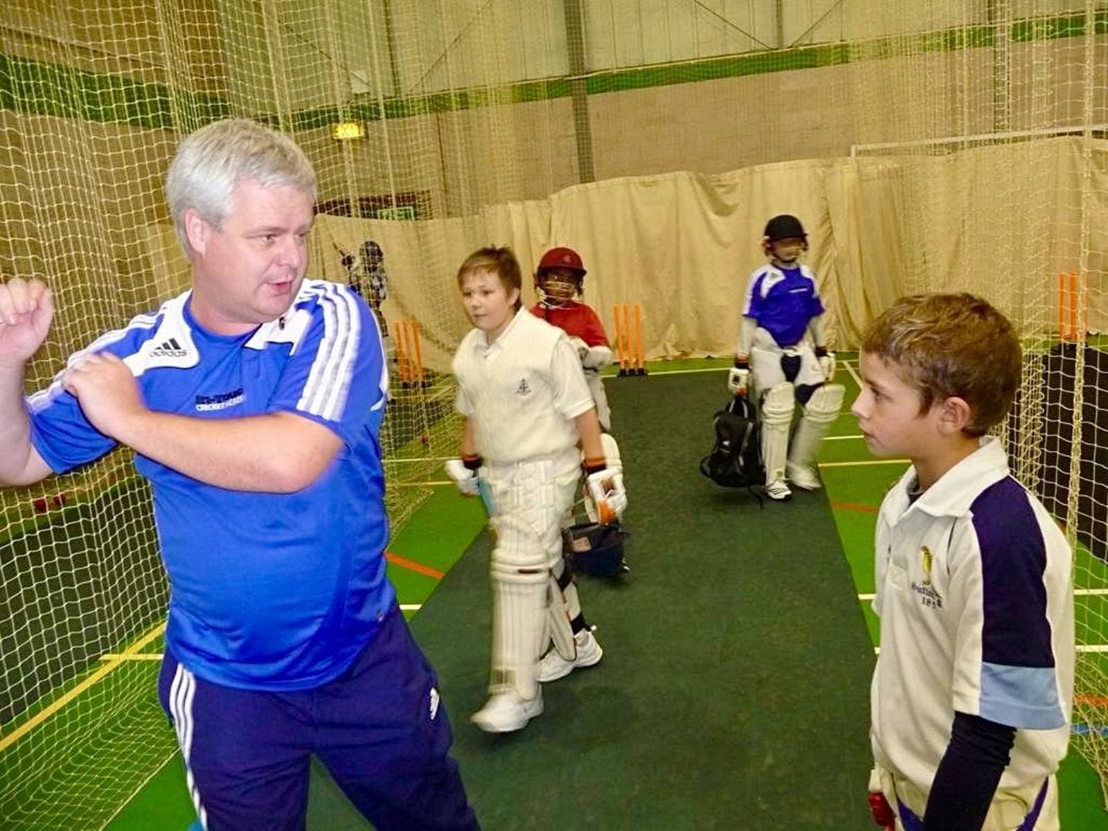 A young Jamie Smith (right) at the In-Touch Cricket Academy (coach in blue is not Matt Homes). (Photo via special arrangement)