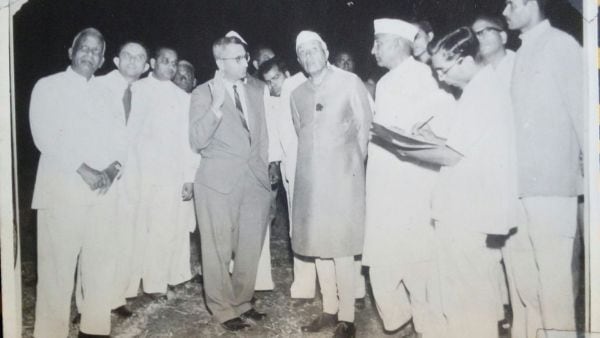 Pandit Jawaharlal Nehru during an interaction with ISRO scientists in 1962. Vikram Sarabhai (2L) and Eknath Chitnis (4L, next to Nehru in suit) seen explaining the working of satellites (Image Credit - The Indian Express archive)