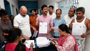 Booth Level Officers (BLOs) verify documents in Patna. (Express Photo by Rahul Sharma)