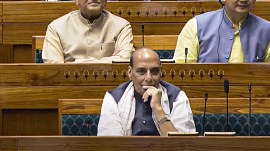 Defence Minister Rajnath Singh with others in the Lok Sabha during the Monsoon session of Parliament