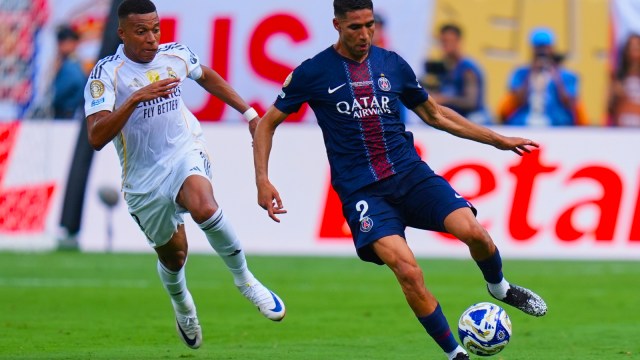 Paris Saint-Germain's Achraf Hakimi (2) plays the ball ahead Real Madrid's Kylian Mbappe (9) chase the ball during the Club World Cup semifinal soccer match between PSG and Real Madrid in East Rutherford, N.J., Wednesday, July 9, 2025. (AP Photo)