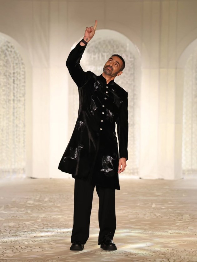 As the curtains fall on Hyundai India Couture Week 2025, the runway left behind a trail of shimmer, emotion, and showstopping glamour. From heritage-inspired storytelling to futuristic silhouettes, this year’s couture celebration was a spectacular meeting of craft and celebrity. With each designer unveiling a distinct vision—and some of Bollywood’s brightest lending their charisma to the catwalk—it was a week where tradition met innovation, and fashion became poetry in motion. Here’s a look back at all the stars who owned the spotlight, one stunning moment at a time.