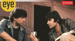 Amitabh Bachchan (Jai) and Dharmendra (Veeru) toss a coin in Sholay