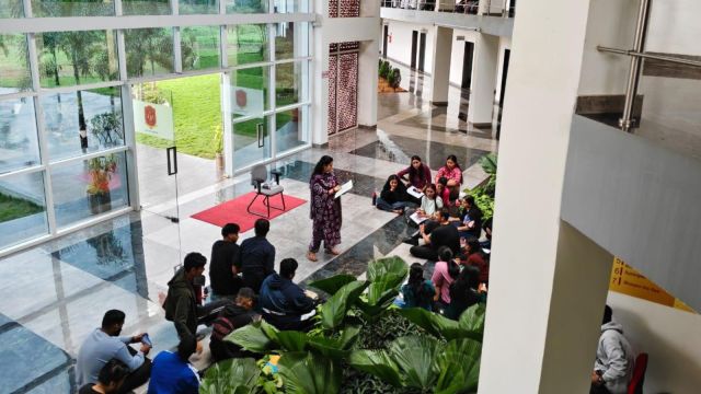 Lectures conducted in the open as students refuse to enter classrooms on day 11 of the protest against the principal at Army Law College, Pune. (Express Photo)