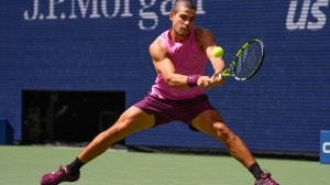 Carlos Alcaraz, of Spain, returns a shot to Luciano Darderi, of Italy, during the third round of the U.S. Open tennis championships, Friday, Aug. 29, 2025, in New York. (AP Photo)