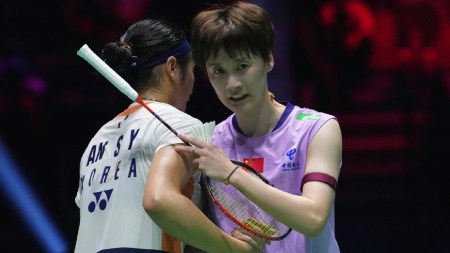 Chen Yu Fei, of China, and An Se Young, of South Korea, embrace each other at the end of their Women's Singles semifinal match of the Badminton World Championships, Saturday, Aug. 30, 2025 in Paris. (AP Photo)