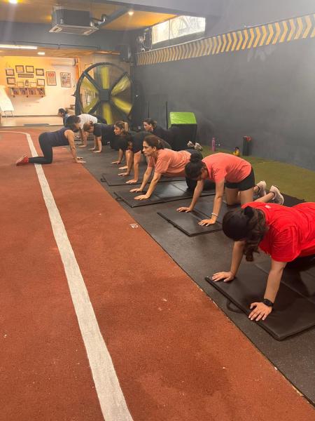 Women at a cool-down session post their training
