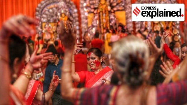Women dance during sindoor khela at a Durga Puja pandal in CR Park, New Delhi. Diasporic identities are often cultivated by associations such as ones hosting Durga Puja in Delhi. (Express Photo by Tashi Tobgyal) *** Local Caption *** Women dance during Sindoor Khela at a Durga Puja Pandal in CR Park, New Delhi on Wednesday. Express Photo by Tashi Tobgyal 051022