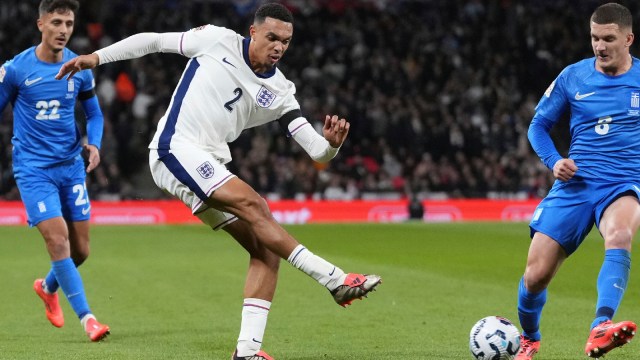 England's Trent Alexander-Arnold, centre, shoots the ball during the UEFA Nations League Group F soccer match between England and Greece at Wembley Stadium in London, on Oct. 10, 2024. (AP Photo)