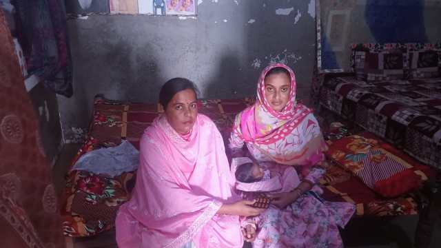 Parveen Kaur with her newborn child at Teja Ruhela village on Tuesday morning. (Express Photo)