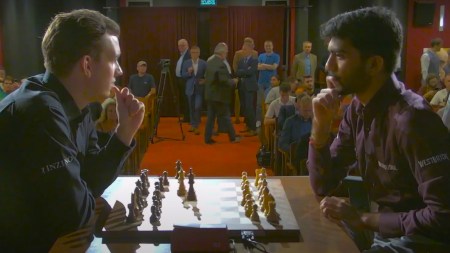 World champion Gukesh Dommaraju analyses a game after losing to Jan-Krzysztof Duda at an exhibition match in Katowice, Poland. (Screengrab via YouTube)