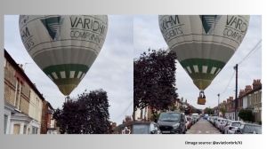As the hot air balloon approaches the ground, onlookers rush to help (Image source: @aviationbrk/X)