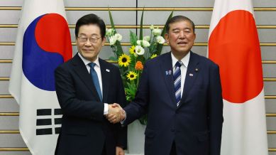 South Korean President Lee Jae Myung, left, meets Japan's Prime Minister Shigeru Ishiba in Tokyo, Saturday, Aug. 23, 2025. (Kim Kyung-Hoon/Pool Photo via AP)