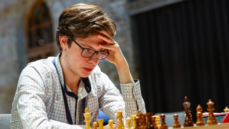 Kirill Shevchenko contemplates his next move during a FIDE chess tournament in 2021. (PHOTO: FIDE/Mark Livshitz)
